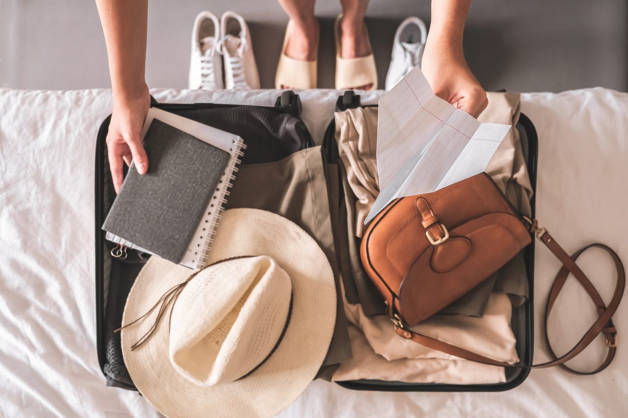 travel-staycation-local-travel-new-normal-girl-traveler-packing-luggage-in-suitcase-travel-tourism-.jpg